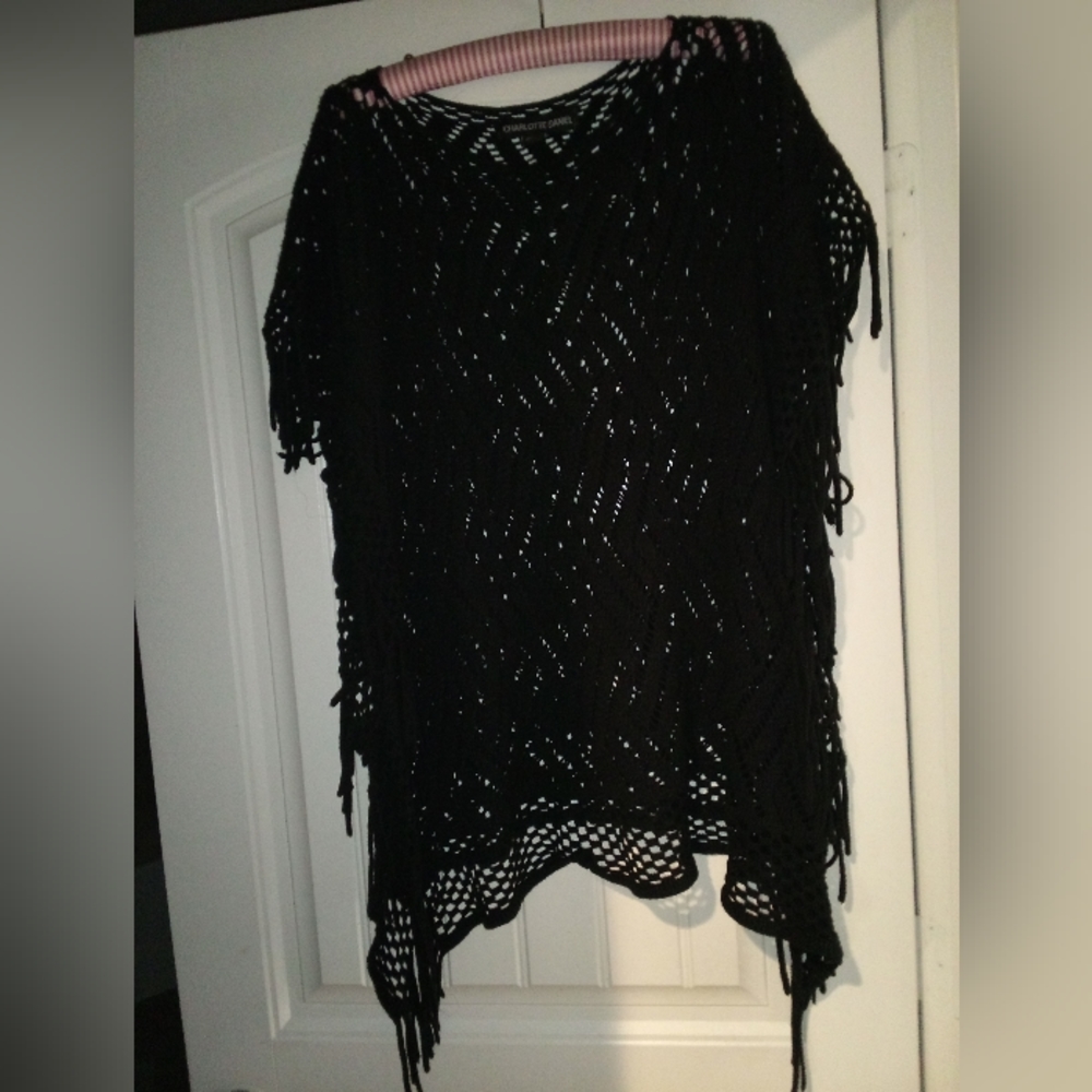Black stringed sweater cape